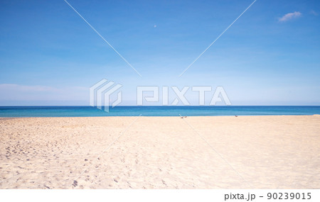 Tropical sandy beach with blue ocean and blue sky background image for nature background or summer background 90239015