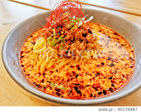 Fire spicy red minced pork tan tan ramen Japanese noodle soup served hot 90239887