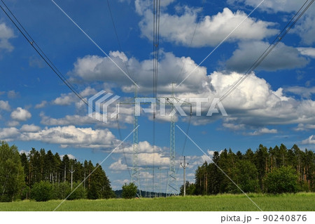 High voltage pylons - Blue sky with clouds and sun in nature. Concept for technology and industry. Further rising electricity and energy prices - the energy crisis caused by the war between Russia and High voltage pylons - Blue sky with clouds and sun in nature. Concept for technology and industry. Further rising electricity and energy prices - the energy crisis caused by the war between Russia and 90240876