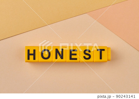 The word honest written on yellow cubes close up. The word honest written on yellow cubes close up. 90243141