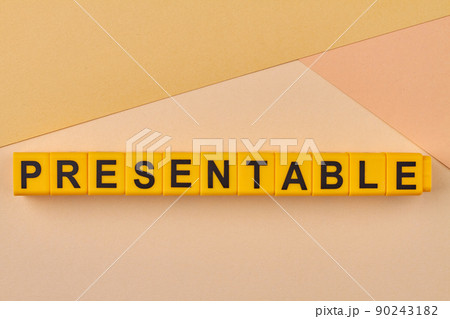 Word presentable written on yellow blocks against color background. 90243182