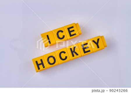 The inscription ice hockey written on yellow cubes isolated on white background. The inscription ice hockey written on yellow cubes isolated on white background. 90243266