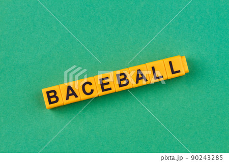 Yellow cubes with inscription baseball on green background. Yellow cubes with inscription baseball on green background. 90243285
