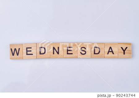 Wednesday word written with vintage wooden cubes and black letters. 90243744