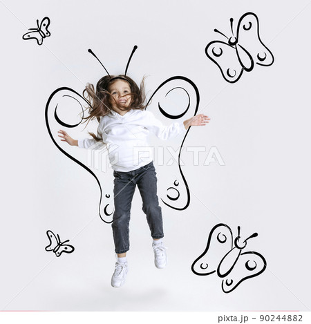 Creative portrait of cute kid, little girl flying like butterfly isolated on grey background with pencil sketch. Concept of ideas, imagination, international children's day 90244882