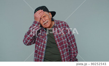 Upset tourist stylish man making face palm gesture, feeling bored, disappointed in result, bad news Upset tourist stylish man making face palm gesture, feeling bored, disappointed in result, bad news 90252543