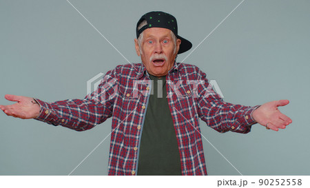 Man raising hands in indignant expression asking why what reason of failure demonstrating disbelief Man raising hands in indignant expression asking why what reason of failure demonstrating disbelief 90252558