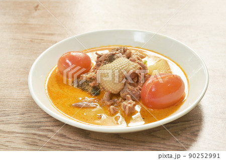 spicy boiled roasted duck meat with pineapple and tomato in coconut milk curry soup on plate spicy boiled roasted duck meat with pineapple and tomato in coconut milk curry soup on plate 90252991