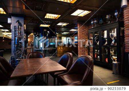 Interior of a dark pub loft interior Interior of a dark pub loft interior 90253079