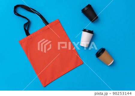 Textile shopping bag and coffee cup flat lay 90253144