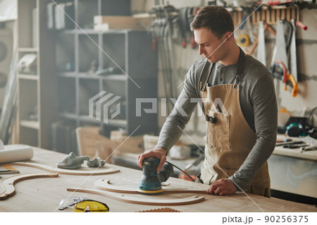 Young Carpenter in Workshop Young Carpenter in Workshop 90256375