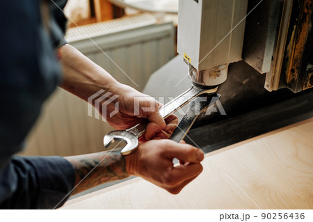 Craftsman Repairing Machine Closeup Craftsman Repairing Machine Closeup 90256436