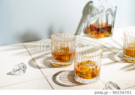 Whiskey with ice in glasses 90256701