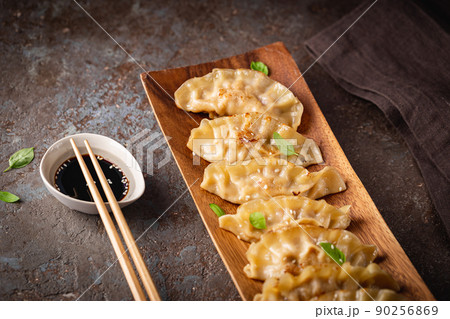Asian dumplings with soy sauce Asian dumplings with soy sauce 90256869