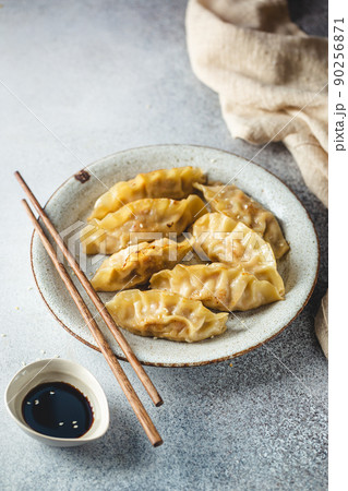 Asian dumplings with soy sauce 90256871