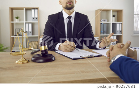 Male lawyer consult client at meeting 90257631