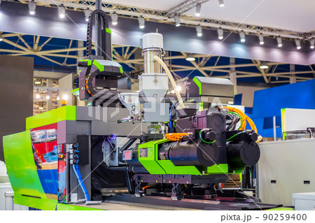 Automatic plastic injection molding machine during work at exhibition Automatic plastic injection molding machine during work at exhibition 90259400