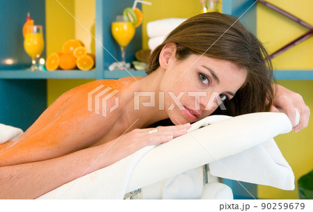 young woman having a treatment for her skin in a beauty salon young woman having a treatment for her skin in a beauty salon 90259679