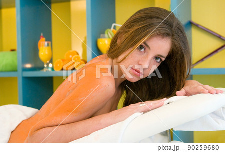 young woman having a treatment for her skin in a beauty salon young woman having a treatment for her skin in a beauty salon 90259680