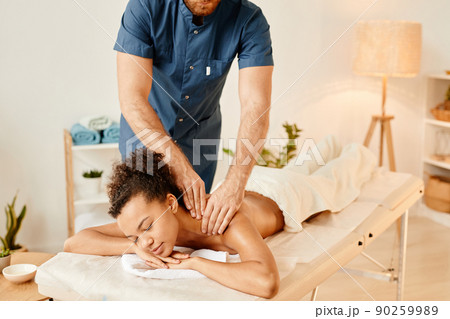 Young Woman Enjoying Massage 90259989