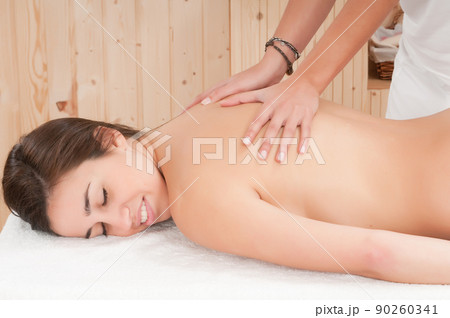 young woman in a spa getting a treatment for her skin 90260341