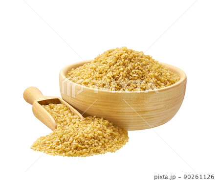 bulgur in wooden scoop and bowl isolated on white background. bulgur in wooden scoop and bowl isolated on white background. 90261126