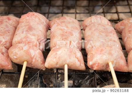 Grilled fermented pork skewers on stove, Thai street food 90263188