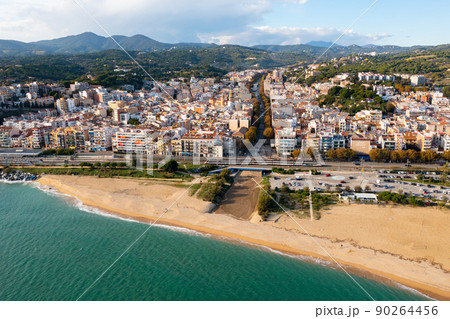 View over the town, beach and the fishing harbor of Arenys de Mar. on the mediterranean coast near Barcelona View over the town, beach and the fishing harbor of Arenys de Mar. on the mediterranean coast near Barcelona 90264456
