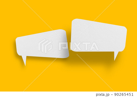 White paper in speech bubble shape set against yellow background. 90265451