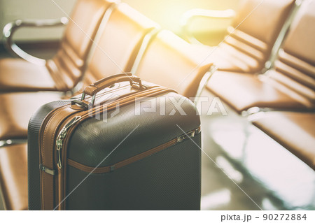 travel luggage bag in airport at waiting area for holiday vacation traveller visitor flight concept 90272884