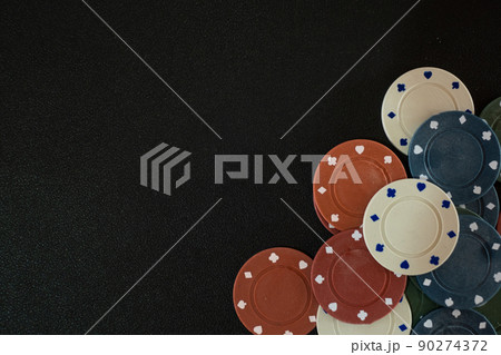 Casino Chip or Poker Chip on Gambling Poker Black Table 90274372