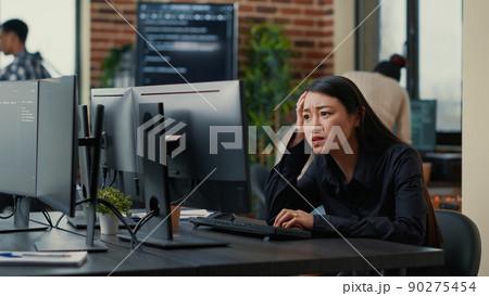 Cyber security programer focused on writing code encounters system failure while parsing algorithm sitting at desk. System engineer having unexpected compiling error while creating software. 90275454