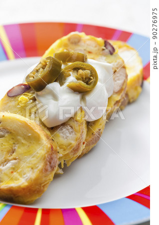 bean dumplings with sour cream and jalapenos 90276975