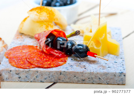 mix cold cut on a stone with fresh pears mix cold cut on a stone with fresh pears 90277377