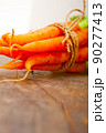 baby carrots bunch tied with rope 90277413
