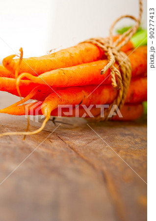 baby carrots bunch tied with rope baby carrots bunch tied with rope 90277413
