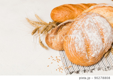 Homemade natural breads. Different kinds of fresh bread as background, perspective view with copy space 90278808