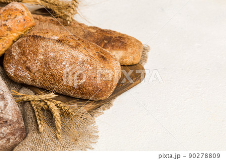 Homemade natural breads. Different kinds of fresh bread as background, perspective view with copy space 90278809