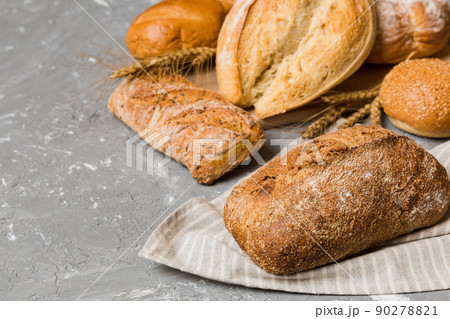 Homemade natural breads. Different kinds of fresh bread as background, perspective view with copy space 90278821