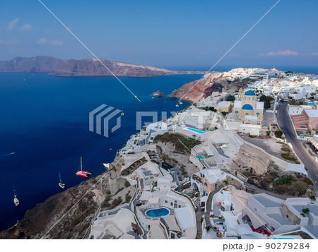 Santorini, Greece. Oia, white village, famous attraction of Greek Cyclades Islands, Aegean Sea. Santorini, Greece. Oia, white village, famous attraction of Greek Cyclades Islands, Aegean Sea. 90279284