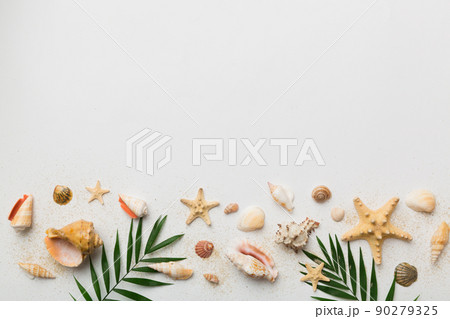Summer time concept Flat lay composition with beautiful starfish and sea shells on colored table, top view with copy space for text Summer time concept Flat lay composition with beautiful starfish and sea shells on colored table, top view with copy space for text 90279325