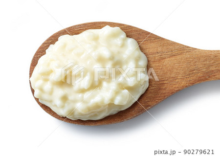 wooden spoon of rice pudding wooden spoon of rice pudding 90279621