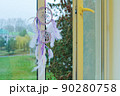 dream catcher on an open window 90280758