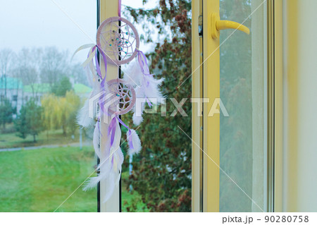 dream catcher on an open window 90280758