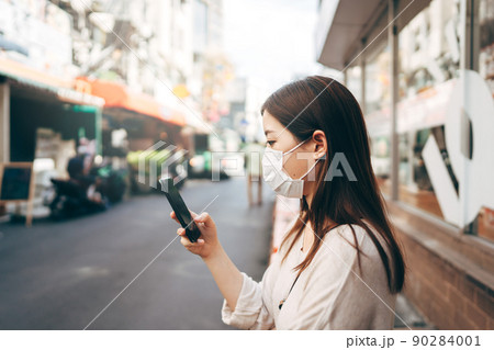 Business young asian single woman wear face mask for protective corona virus or covid 19 90284001