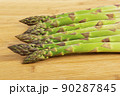 Vegetarian fresh green asparagus. vegetable on wood 90287845