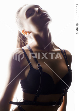 Beautiful woman in leather belt and Hat. sexy girl in white lights 90288274