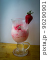 Strawberry ice cream with blurried strawberry and Milk on a foreground. High quality photo 90290901