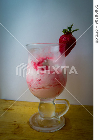 Strawberry ice cream with blurried strawberry and Milk on a foreground. High quality photo Strawberry ice cream with blurried strawberry and Milk on a foreground. High quality photo 90290901