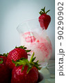 Strawberry ice cream with blurried strawberry and Milk on a foreground. High quality photo 90290902
